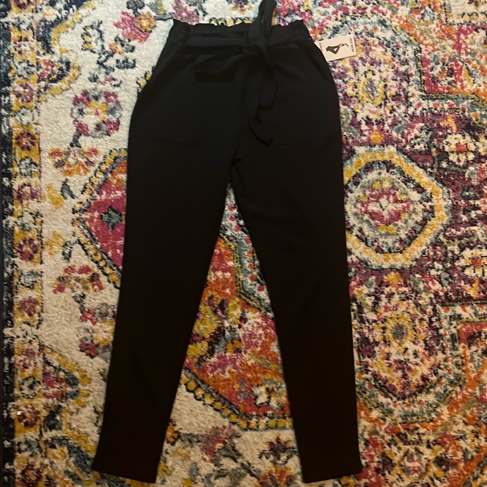 Slim fit size Large dress pants/ leggings. Black and never worn with tag.